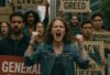 Citizens marching in a grassroots movement, holding general strike signs to challenge corporate control.