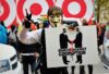 man holding sign about marching against corruption.